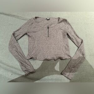 Pink long sleeve shirt with zipper detail by collar